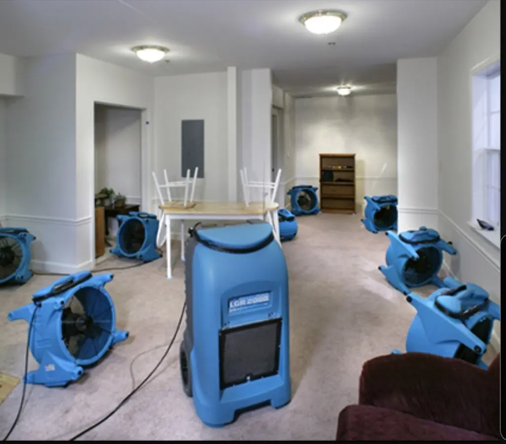 Air movers and dehumidifier setup for Water Damage Restoration in Wakefield